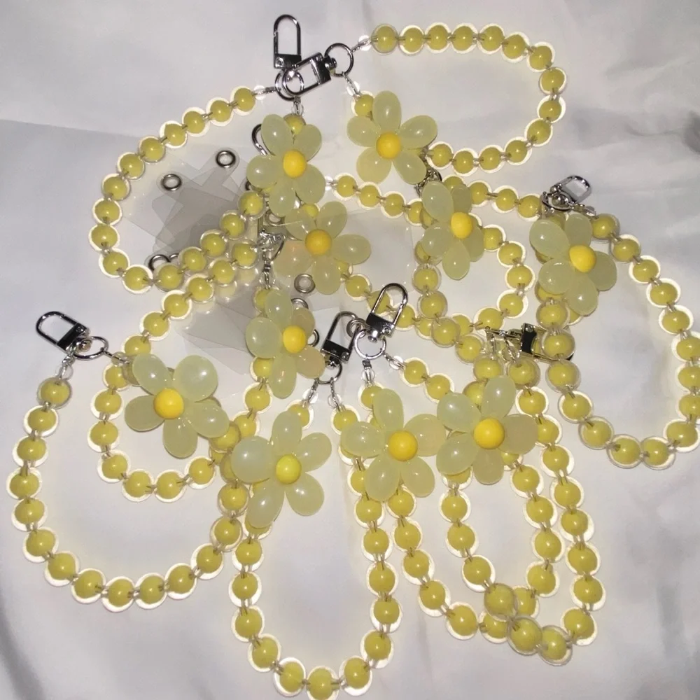 1-wrist lanyard for cells, keys and more Yellow Oversized Flower Charm